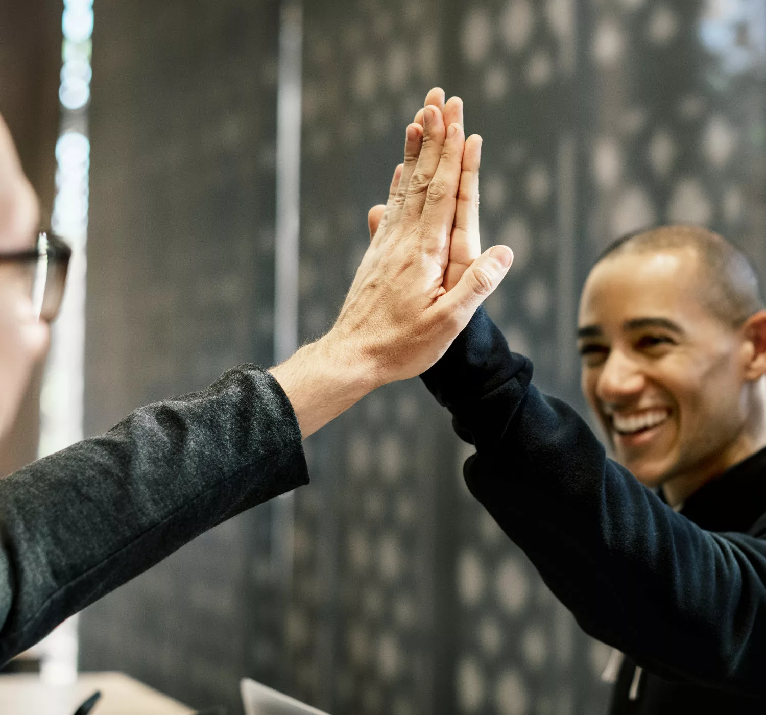 Bluefinch-esbd - colleagues giving high five